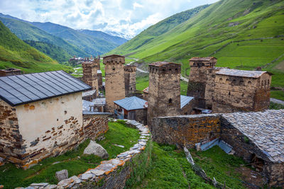 High angle view of houses and buildings against sky