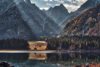 Scenic view of lake and mountains against sky