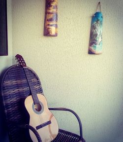 Close-up of guitar on table at home