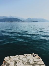 Scenic view of lake and mountains against clear sky