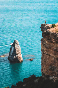 High angle view of rock formations in sea