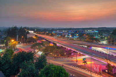 High angle view of light trails on road at night