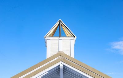 Low angle view of building against blue sky