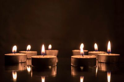Close-up of lit tea light candles