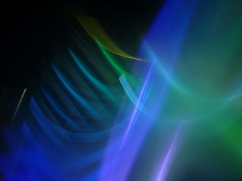 Abstract image of illuminated lights against black background