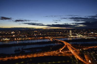 Aerial view of illuminated city at night