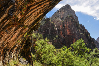 Low angle view of rock formation against sky