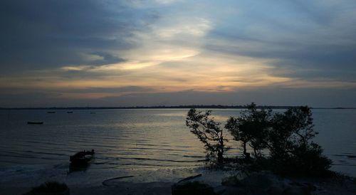 Scenic view of lake against sky during sunset