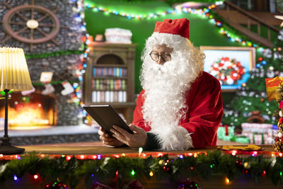 Midsection of woman holding christmas tree