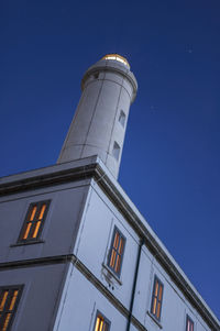 Low angle view of building against blue sky