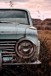 Abandoned car on field