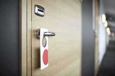 Label hanging on hotel door handle