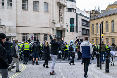 Group of people walking on city street