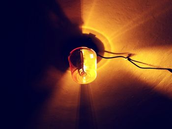 Close-up of light bulb on table