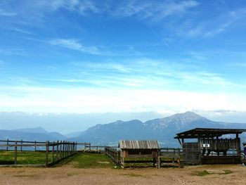 Scenic view of mountains against cloudy sky