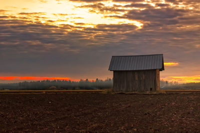 Built structure on countryside landscape against scenic sky