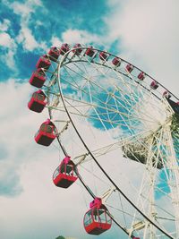 Low angle view of ferris wheel against sky