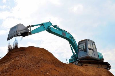 Low angle view of construction site against sky