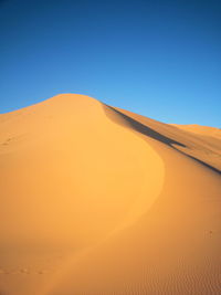 Scenic view of desert against clear sky