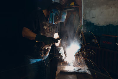 Man welding in workshop