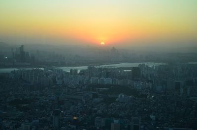 High angle view of buildings against sky during sunset