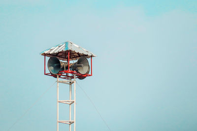 Low angle view of street light against clear blue sky