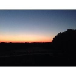 Scenic view of landscape against sky at sunset