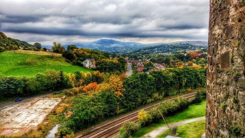 Scenic view of mountains against cloudy sky