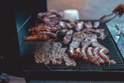 High angle view of meat on barbecue grill