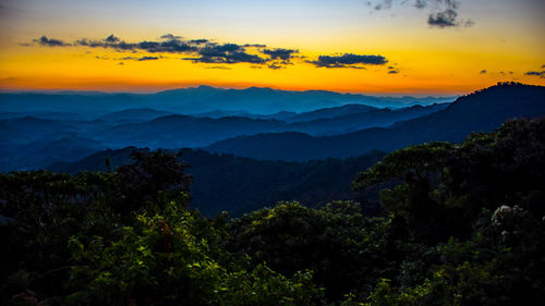 Scenic view of mountains at sunset