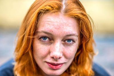 Close-up portrait of smiling young woman