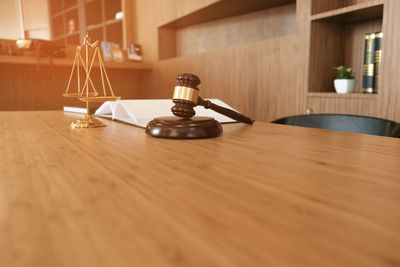 Close-up of open book on table at home