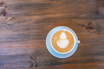 High angle view of cappuccino on table