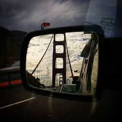 Cars on road against sky