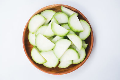 Directly above shot of salad in bowl against white background