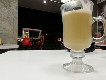 Close-up of beer glass on table