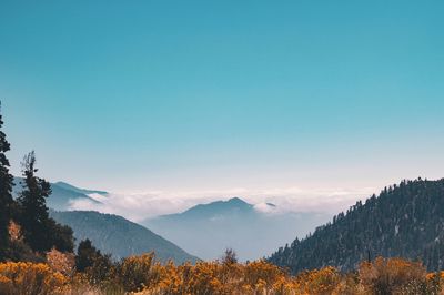 Scenic view of mountains against clear blue sky