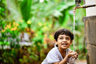 Portrait of girl drinking water