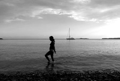 Full length of sea against cloudy sky