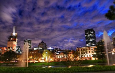 Illuminated buildings in city at night