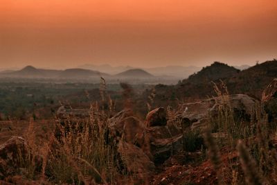 Idyllic view of landscape against sky during sunset