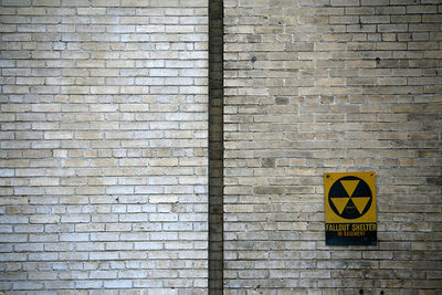 Text on brick wall