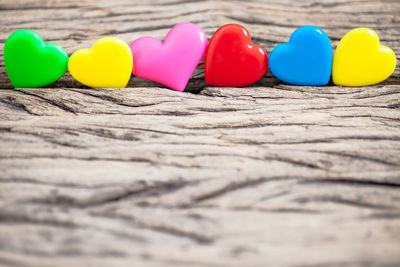 Close-up of multi colored balloons on sand