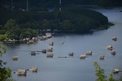 Boats moored in river