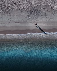 High angle view of person working on beach