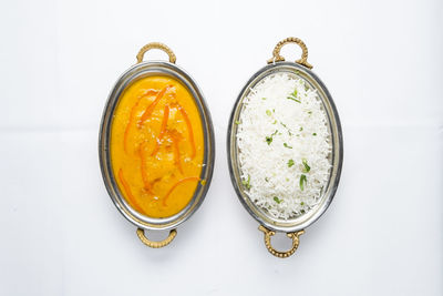 High angle view of drink on table against white background