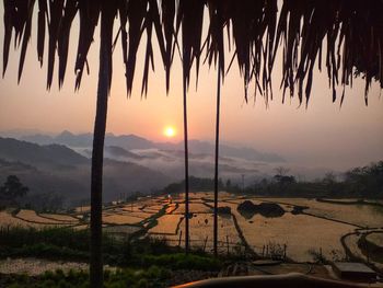 Scenic view of landscape against sky during sunset