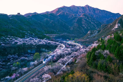 High angle view of road by mountains against sky