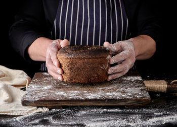 Midsection of man preparing food