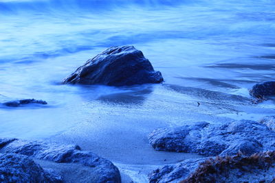 Scenic view of sea against blue sky